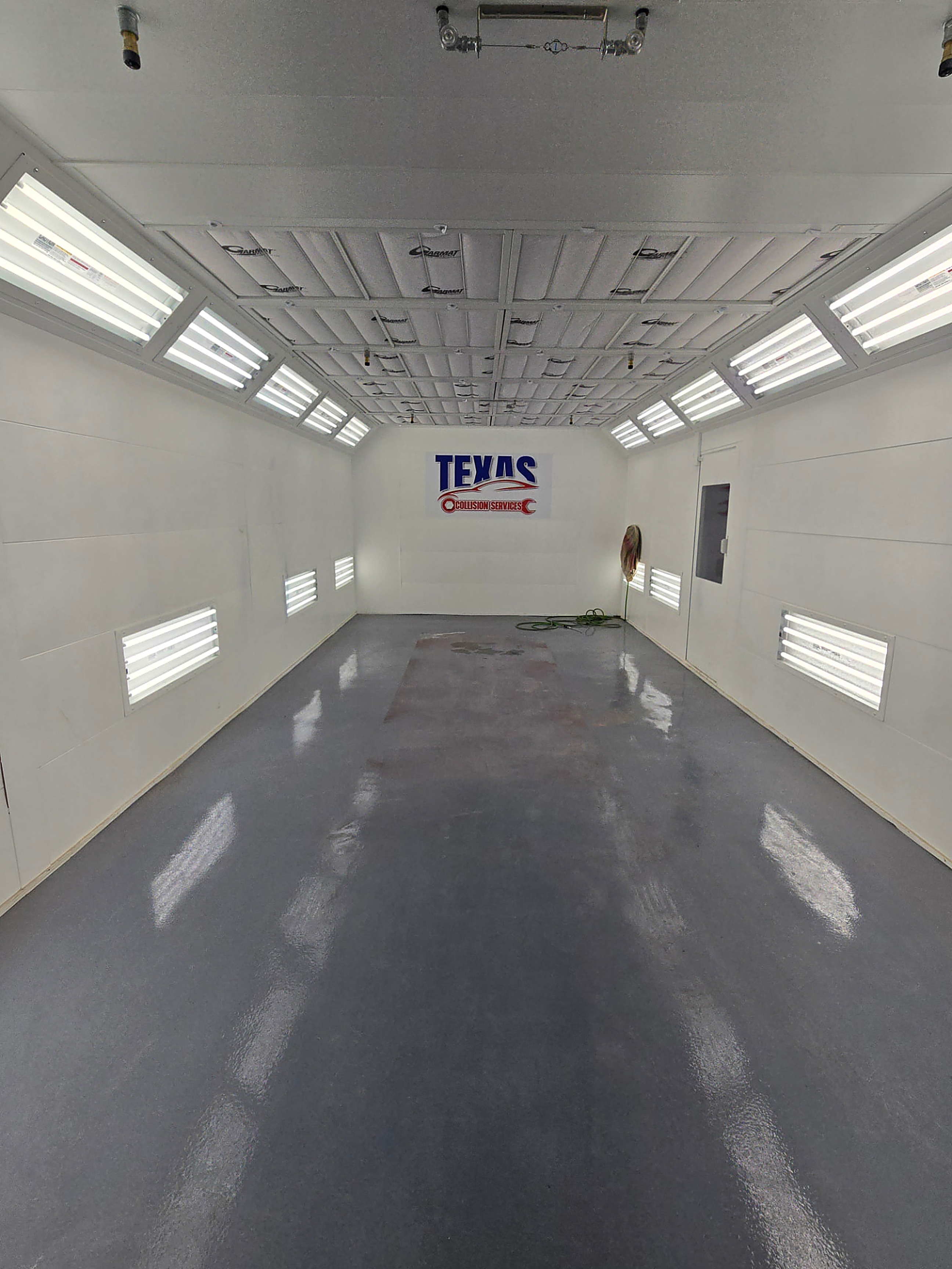 Interior of the Garmat downdraft paint booth at Rayco Collision Center