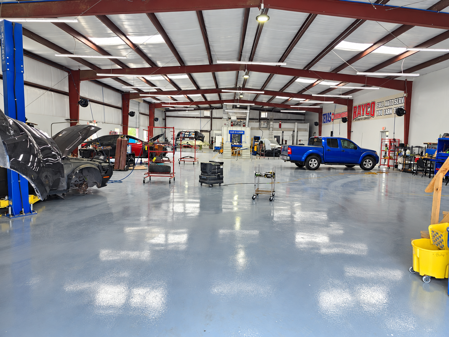 Vehicles inside the Rayco repair shop