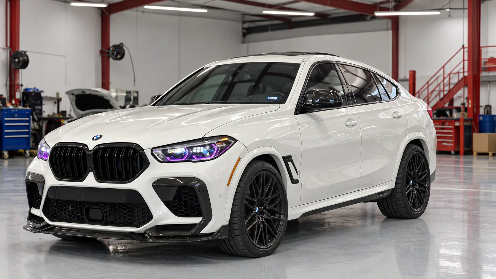 White BMW SUV inside the Rayco shop